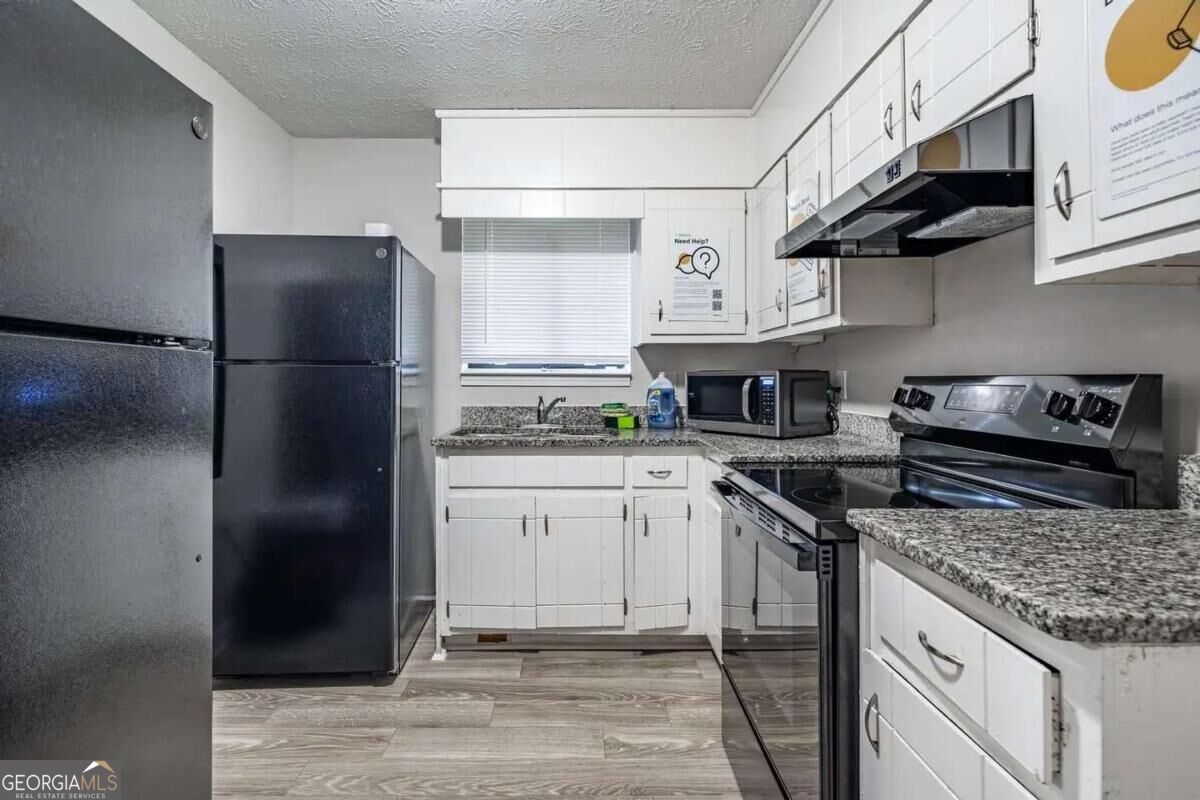 Listing Photo 5 - Condo for sale in building located at 7344 Camelot Ct, Riverdale, GA 30296