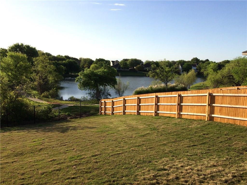 A spacious backyard provides direct water access and offers serene lakeside living.
