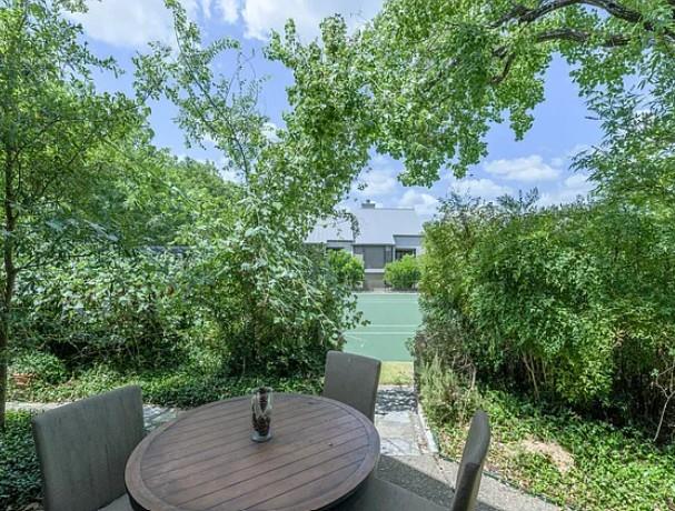 Enjoy outdoor dining and court views from this tranquil, peaceful patio.