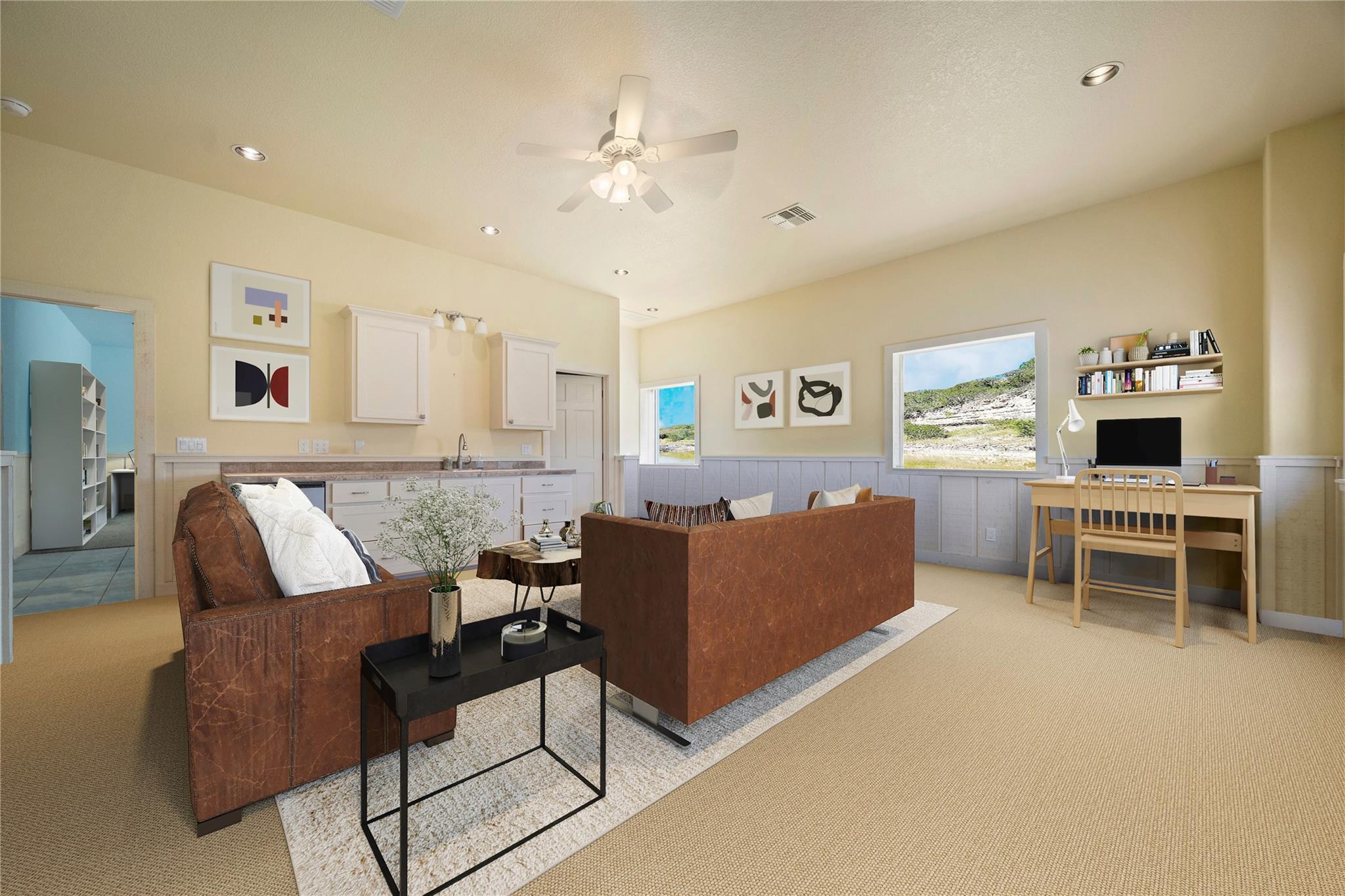 Living room with light carpet, wainscoting, recessed lighting, ceiling fan, and an office area