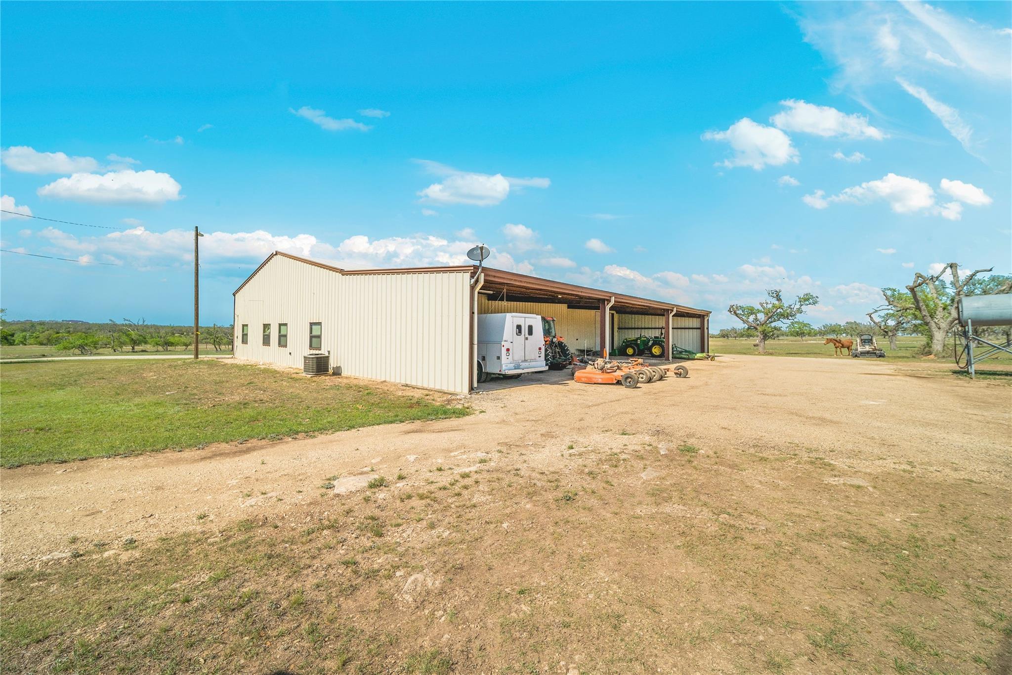 A spacious barn on a rural property provides ample room for equipment and storage.