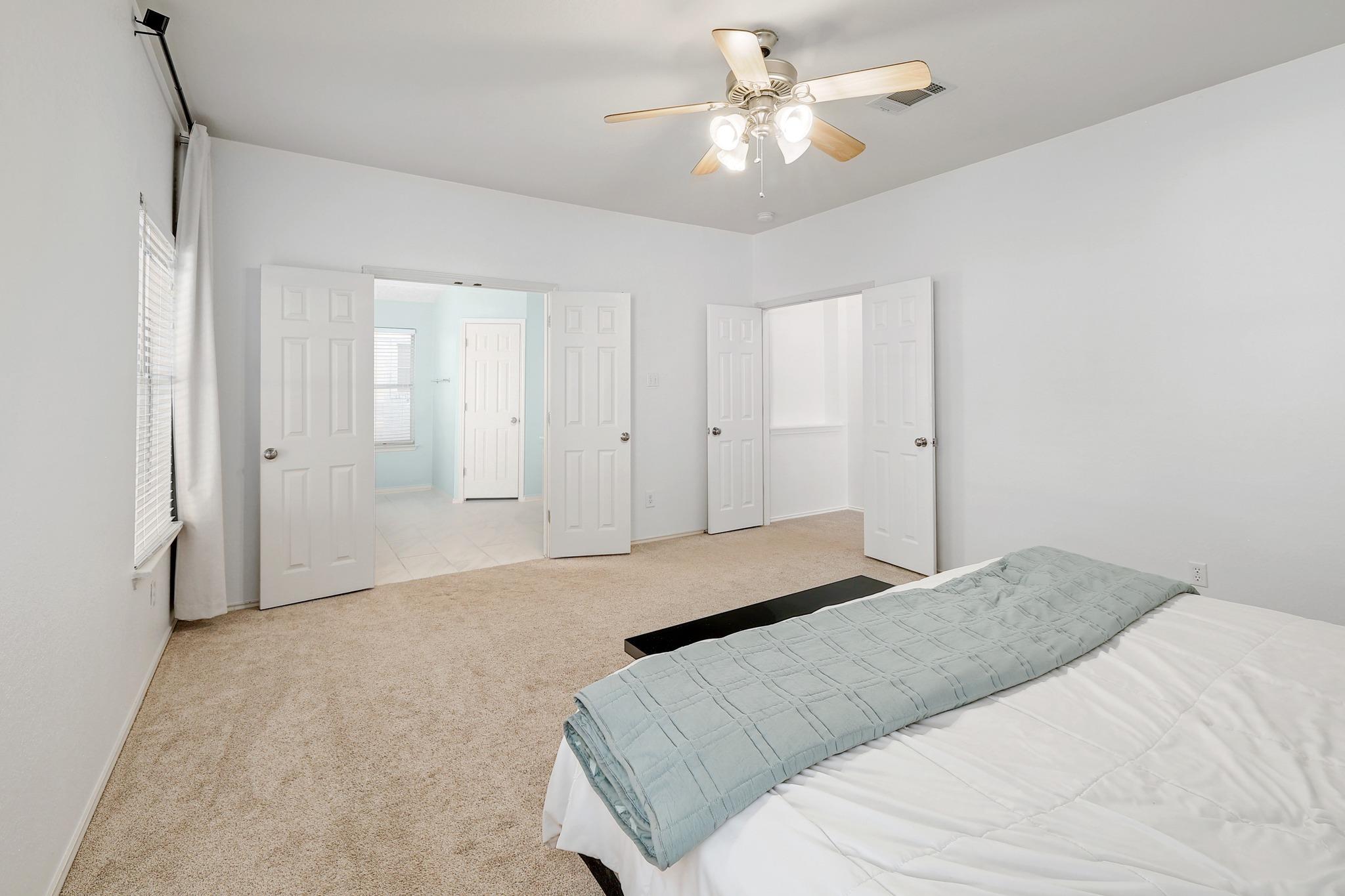 Plush carpeting and dual entryways define this comfortable space.