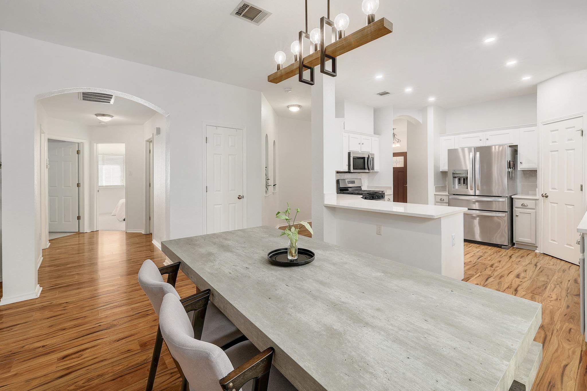 Open layout connecting the dining space and kitchen.