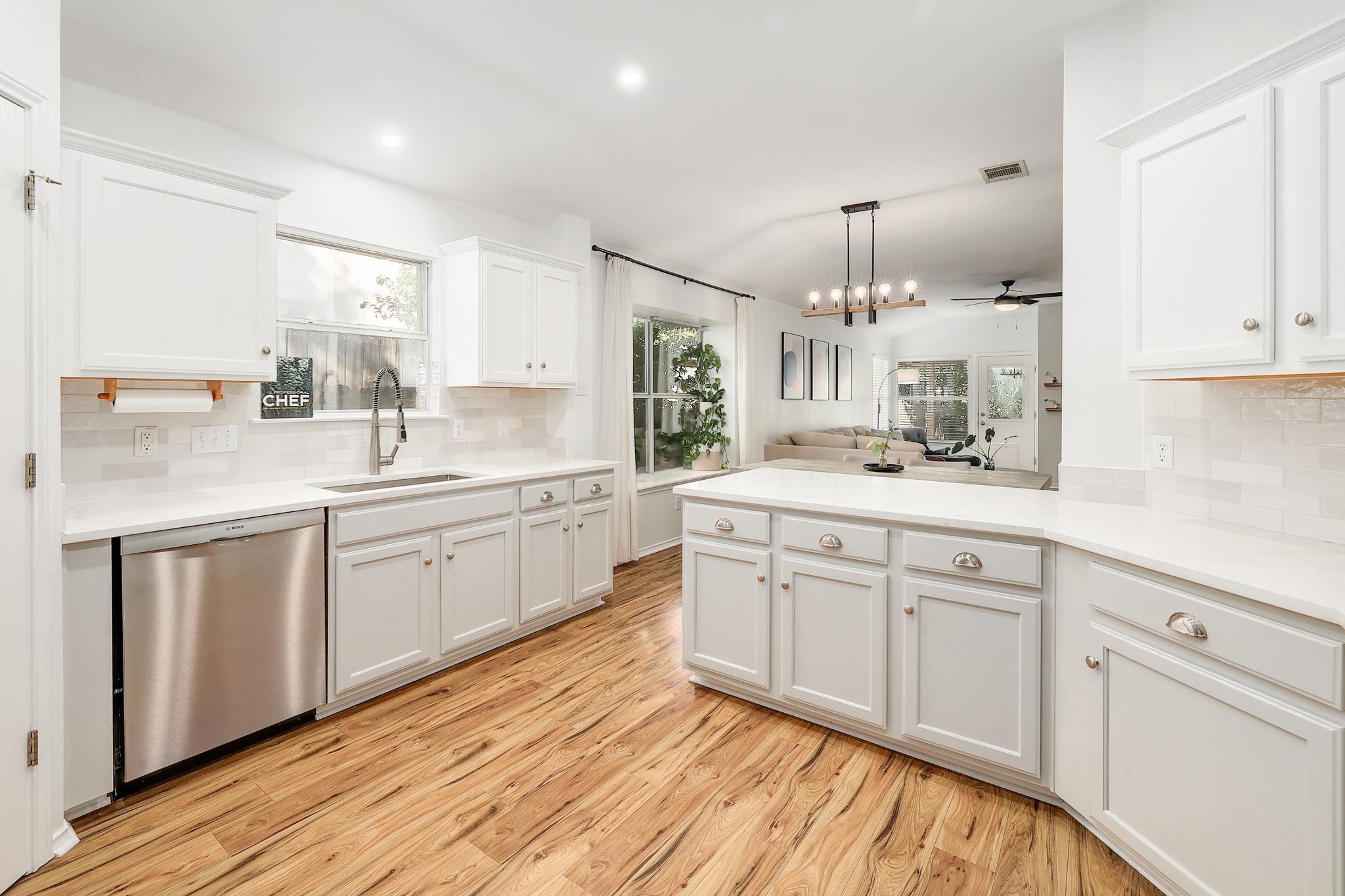 Pristine cabinetry and stone countertops.