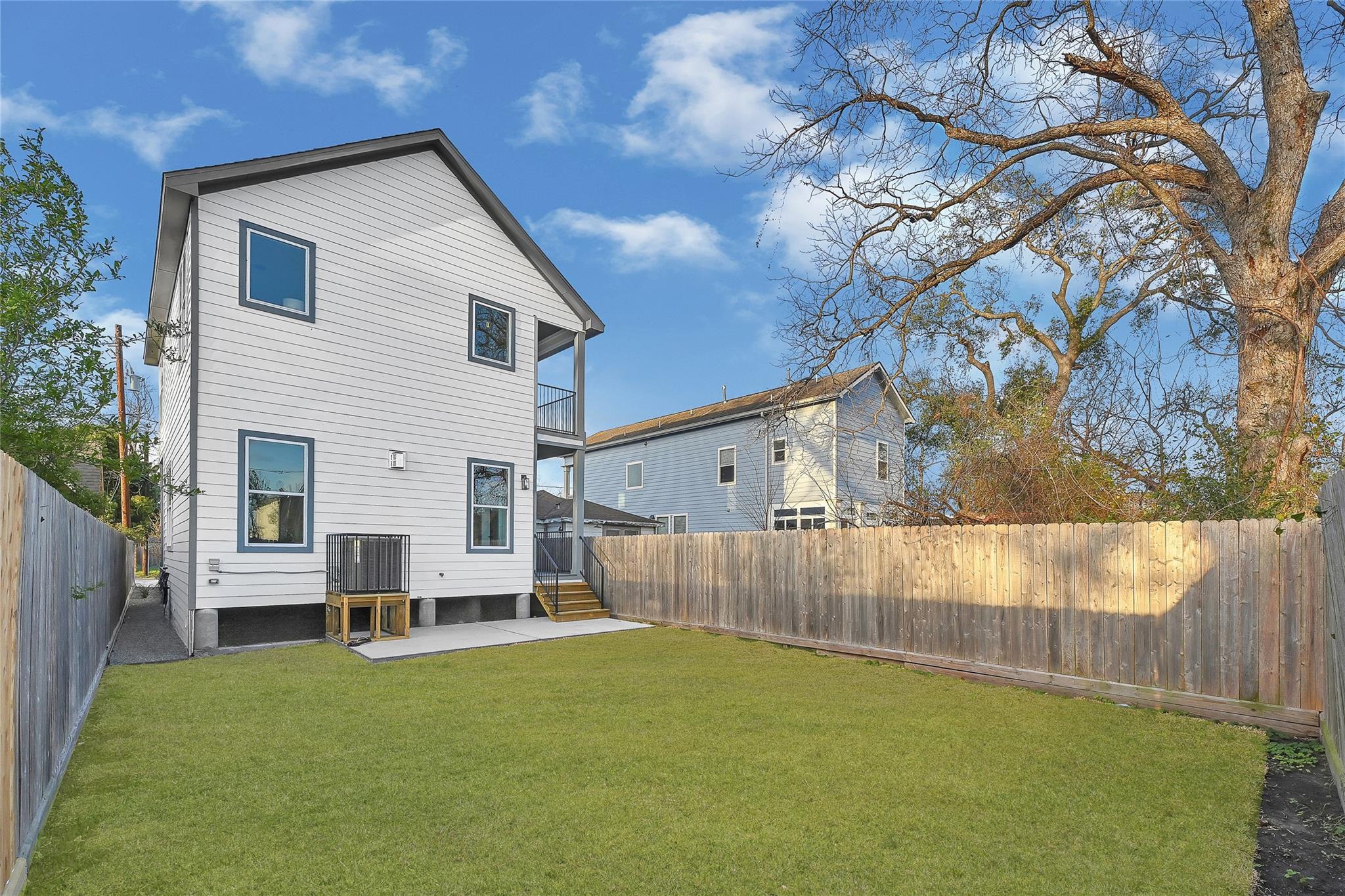 Spacious backyard offering ample green space with endless potential to design your ideal outdoor retreat