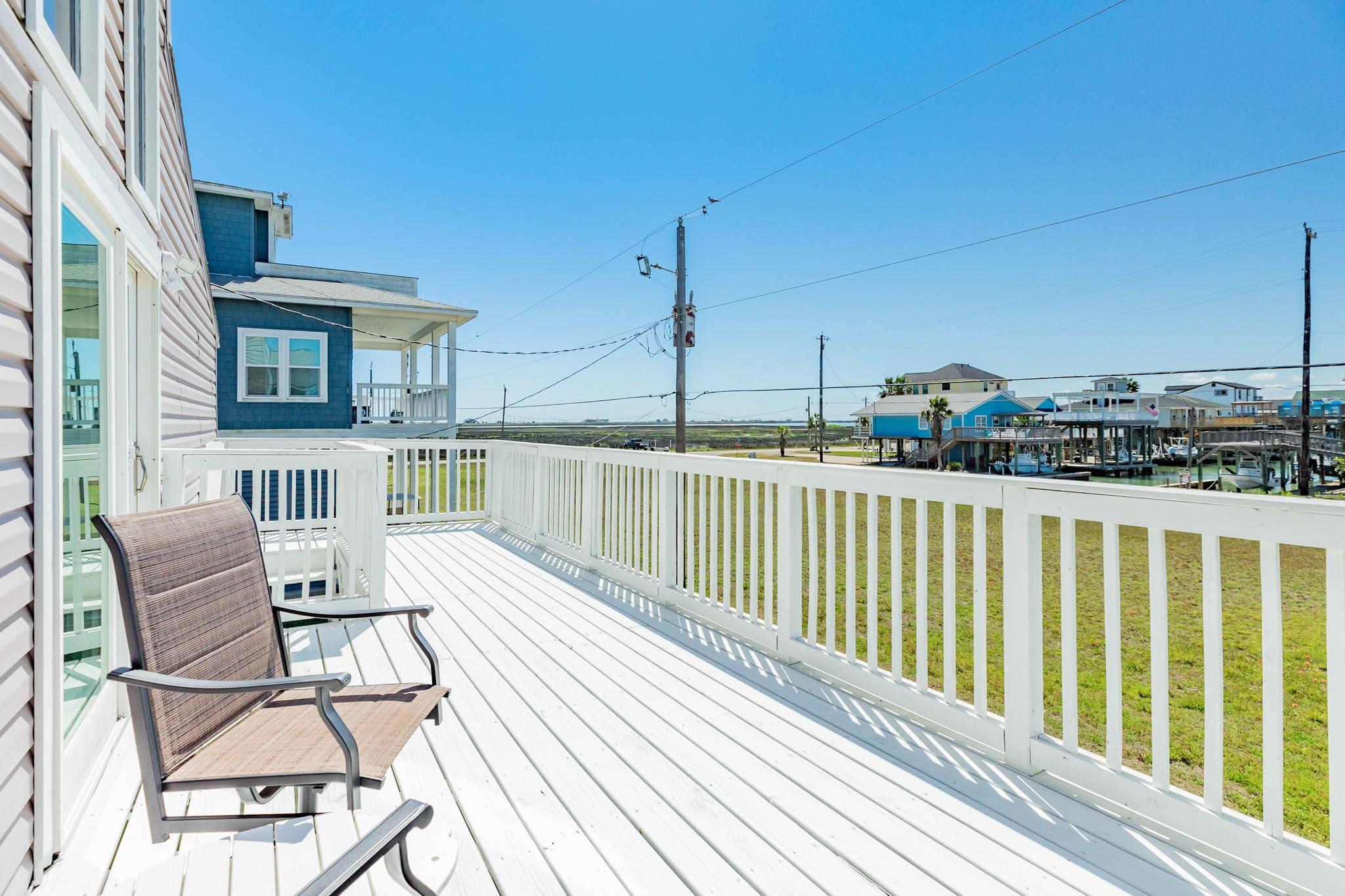 Deck Seating Area – Comfortable outdoor seating area positioned to take advantage of natural light and neighborhood views.