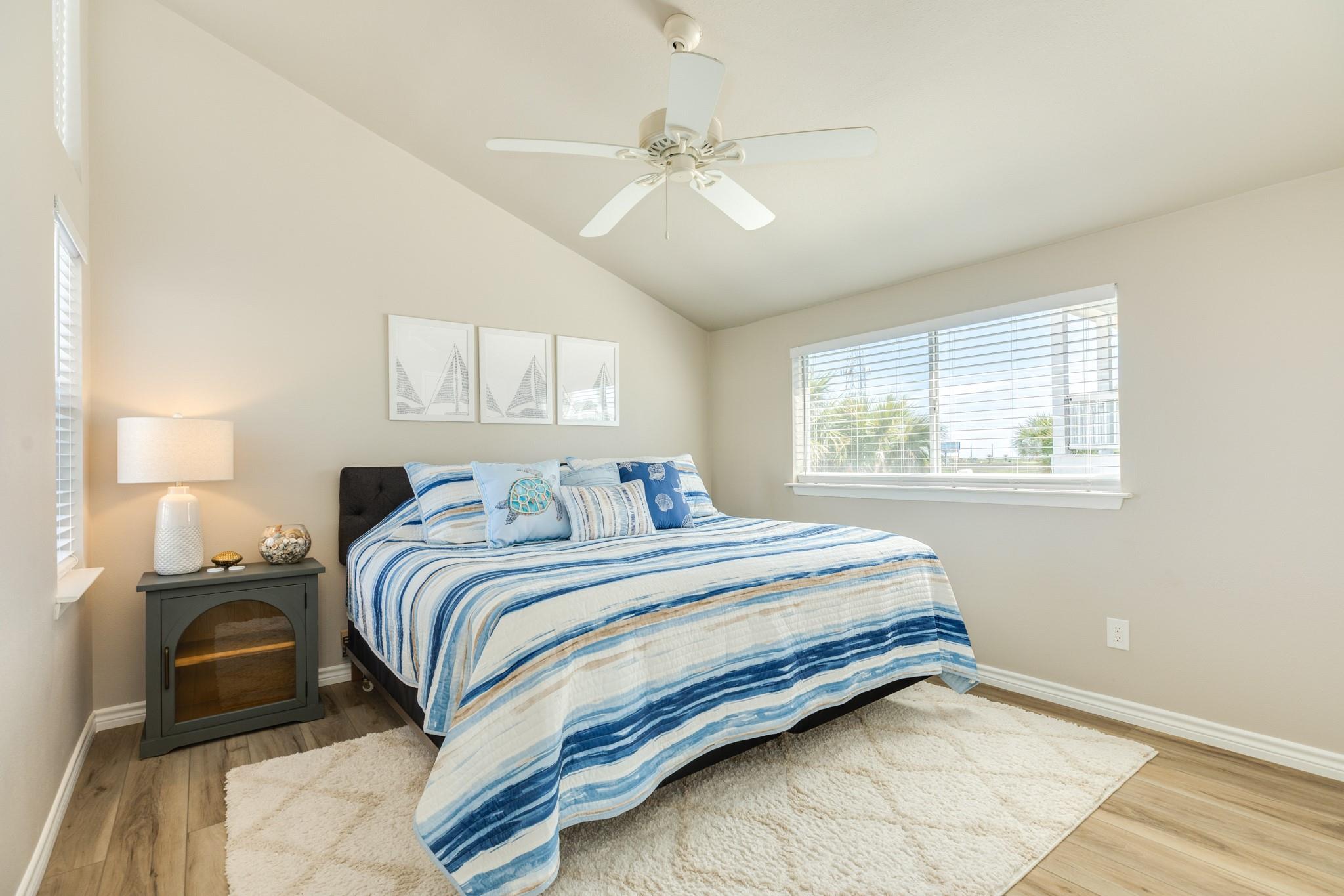 Bedroom – Comfortable secondary bedroom featuring ample natural light, neutral tones, and a ceiling fan for added comfort.