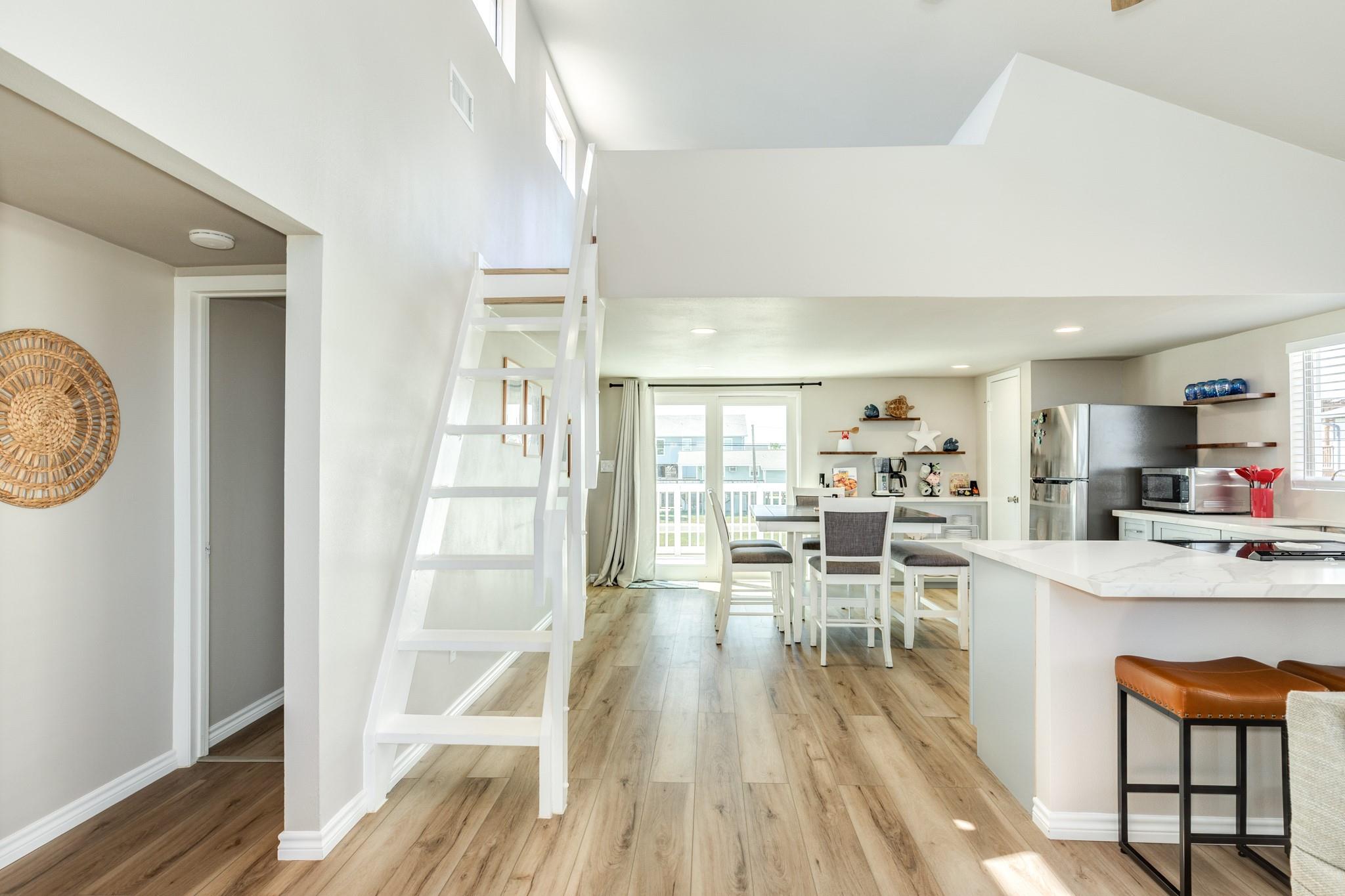 Hallway & Loft Stair Access – Clean, modern staircase leads to the loft area, adding flexibility for additional sleeping or recreation space.