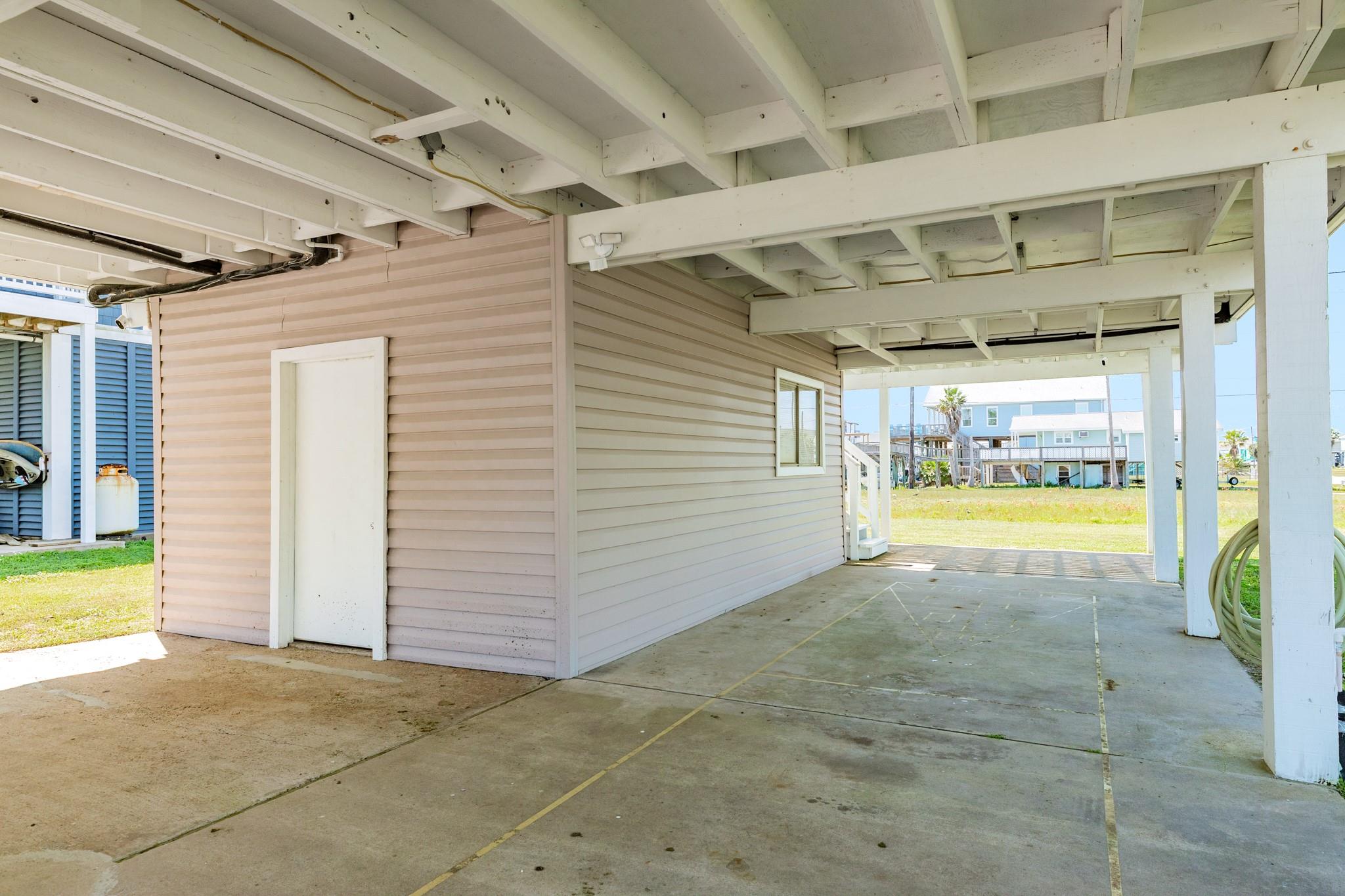 Ground-Level Storage – Enclosed storage area beneath the home with 1/2 bath  provides convenient space for tools, beach gear, or seasonal items.