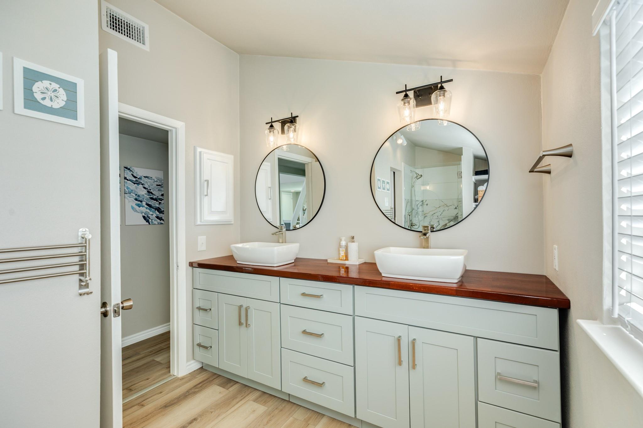 Bathroom (Double Vanity) – Stylish bathroom with dual vessel sinks, modern fixtures, and a spacious vanity offering plenty of storage.