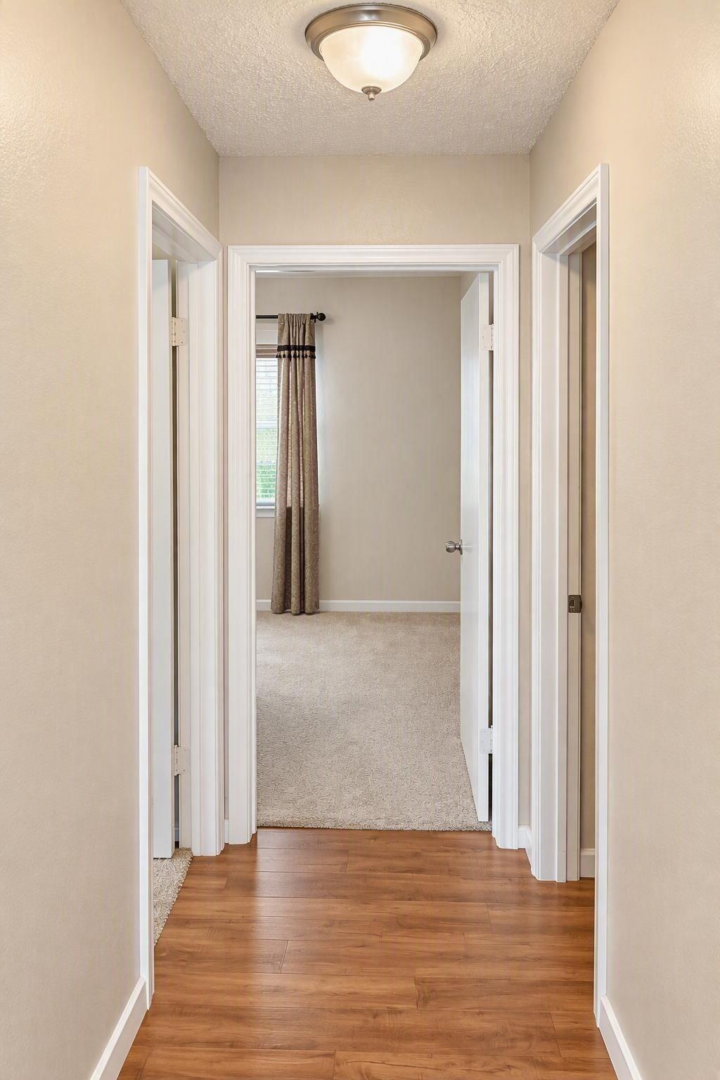 Secondary hall leads to the second bath and bedrooms 2 & 3