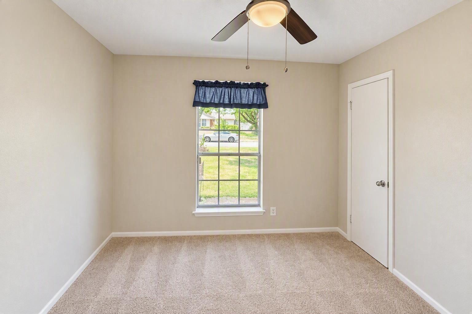 2nd bedroom , features ceiling fan and walk in closet
