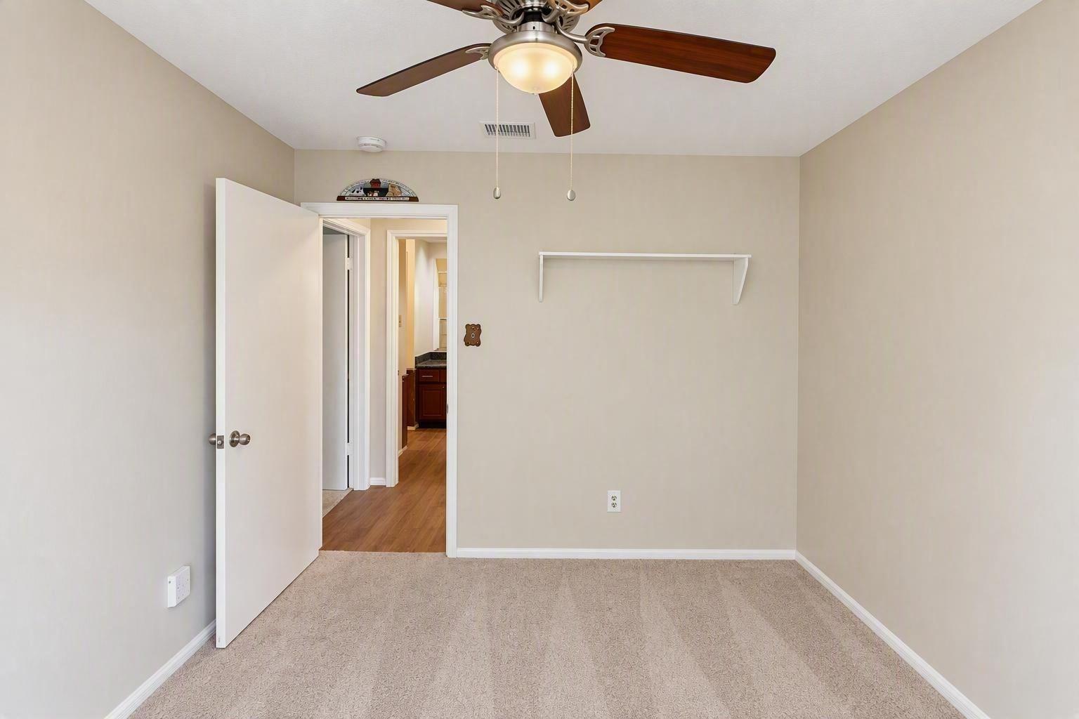 3rd bedroom also features a ceiling fan and walk-in closet