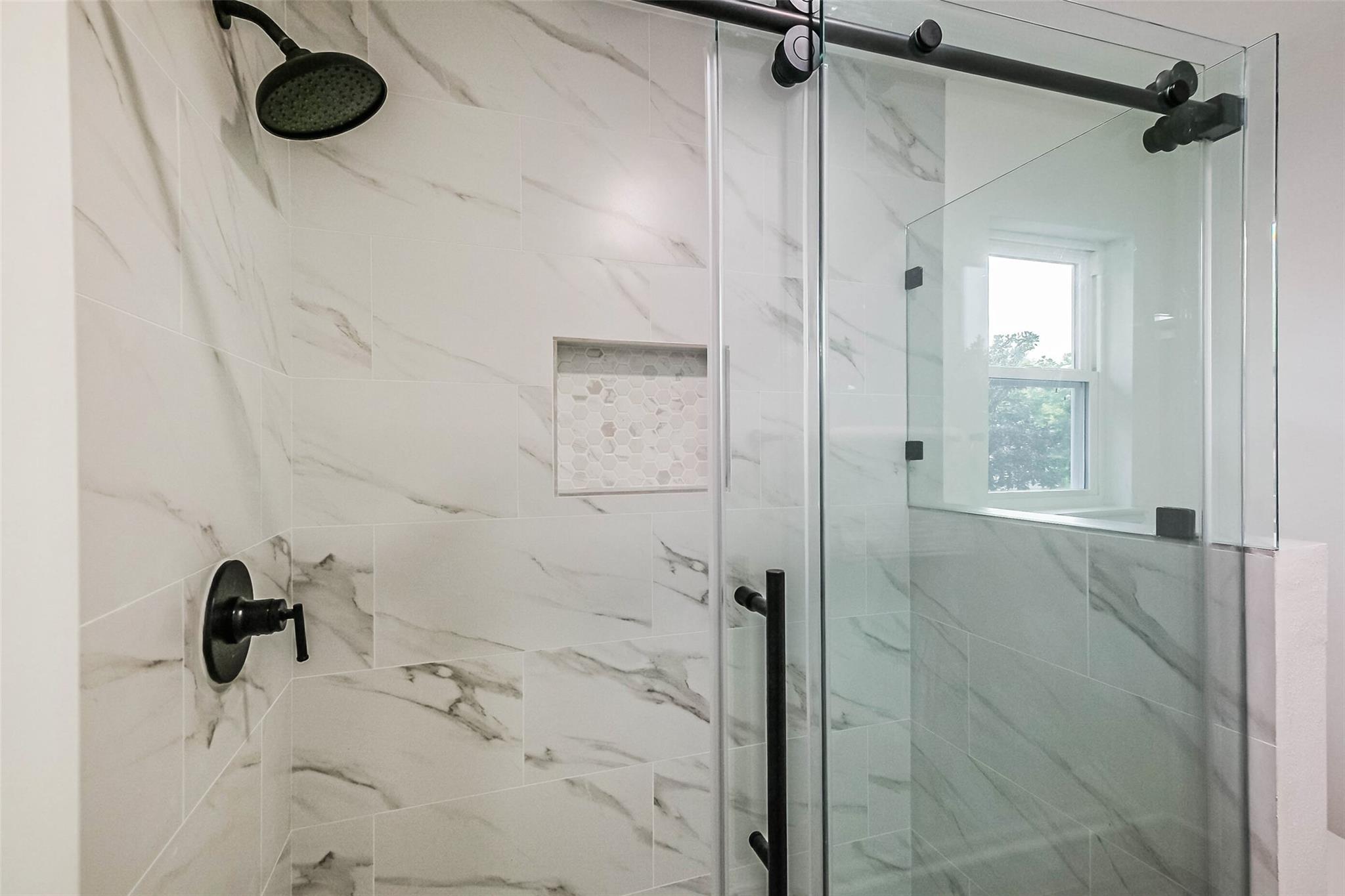 The primary has this delightful power shower.