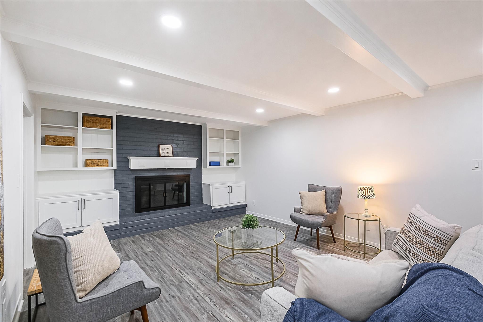 The family sized living room has a gas fire as the focal point.