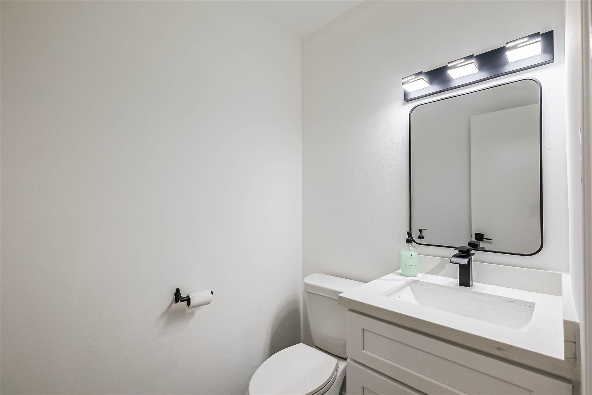 The 1st floor has this discreet powder room.