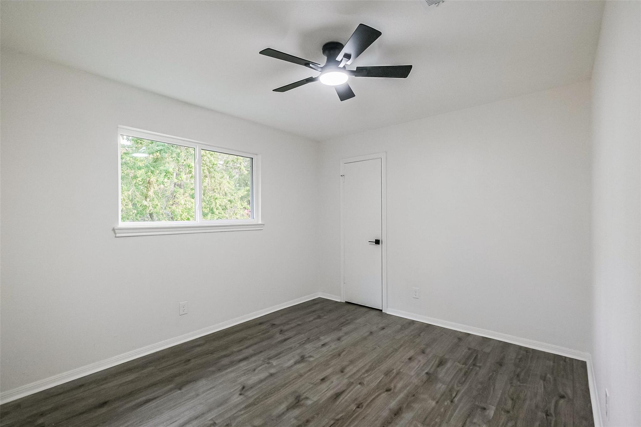 Bedroom 2 upstairs. All of the bedrooms have good, proportioned closets and natural light.