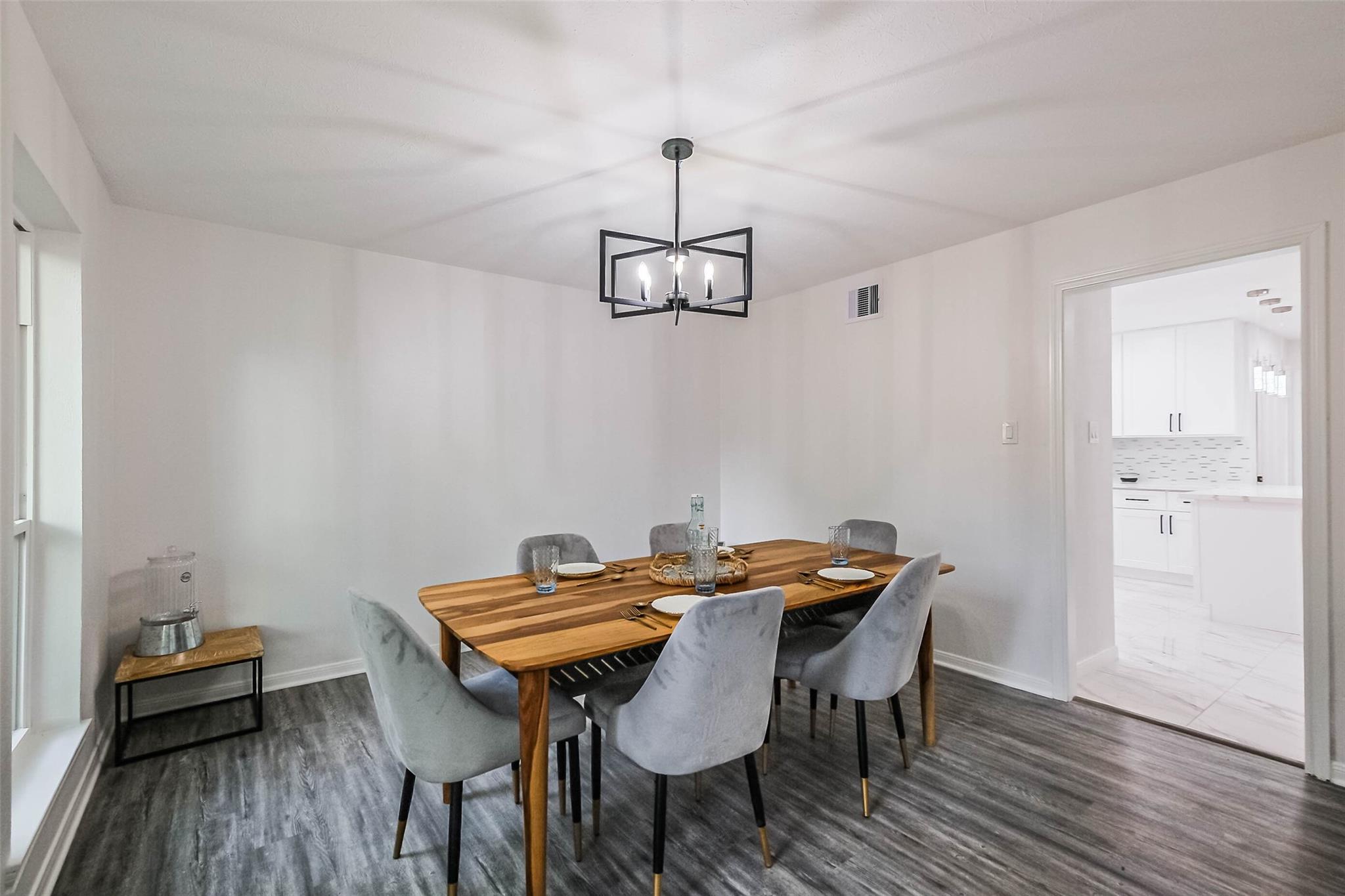 The dining room is ideally located next to the kitchen.